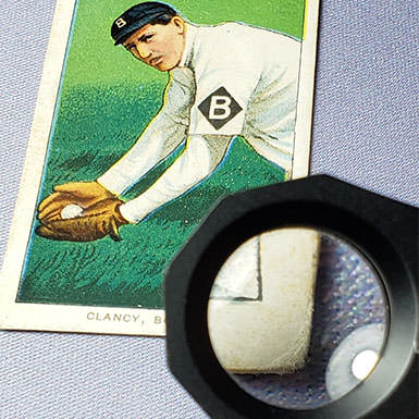 Sports card under a magnifying glass