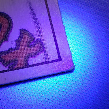 Sports card under a ultra violet light